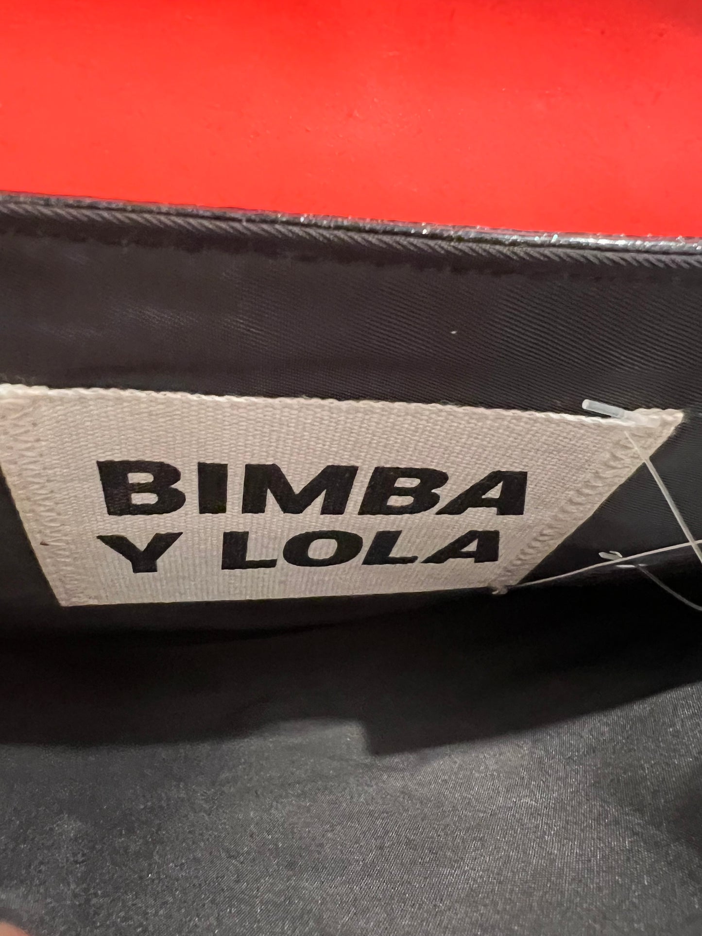 BIMBA Y LOLA. Bolso de mano plateado