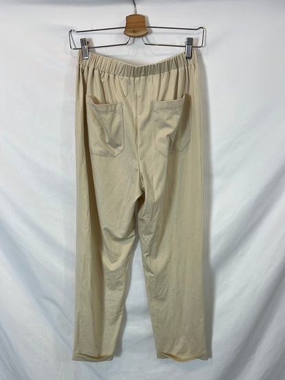 19.70. Pantalón beige fluido T.s/m