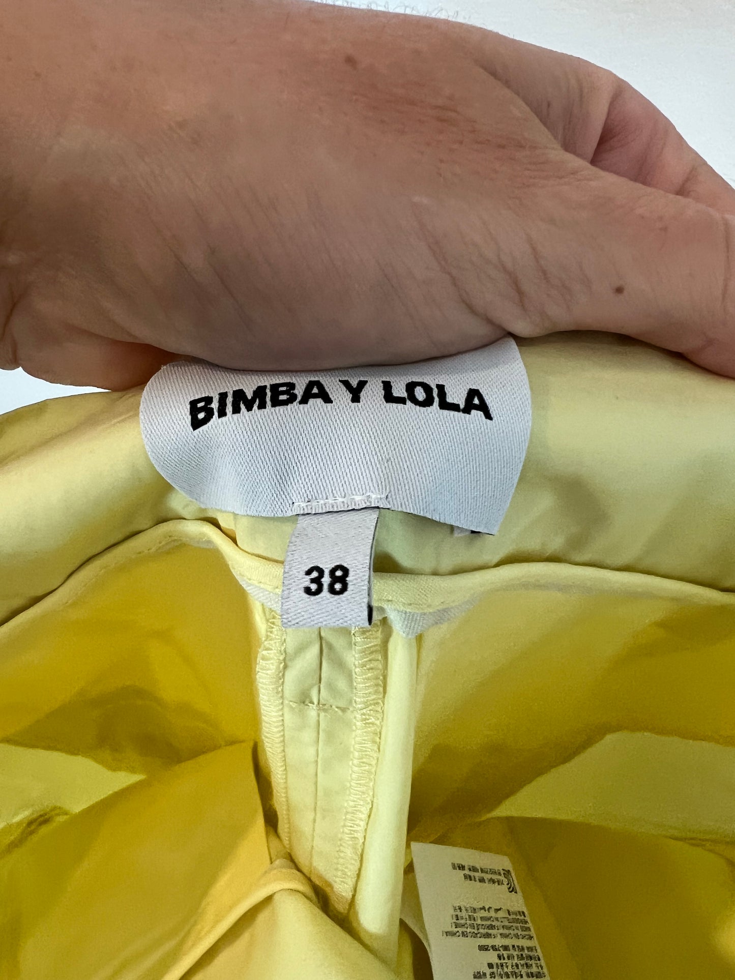 BIMBA Y LOLA. Pantalón tono pastel pata ancha. T 38