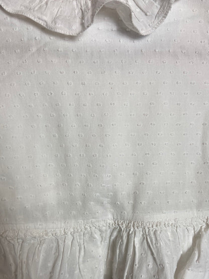 OTRAS. Blusa blanca plumeti volante. T 12 meses