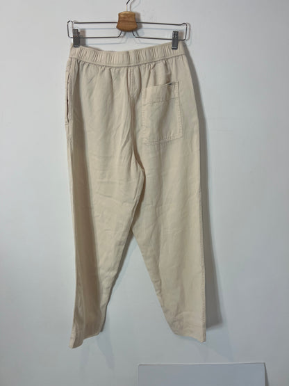 FREEDOM OF MOVEMNET. Pantalón beige fluido. T S