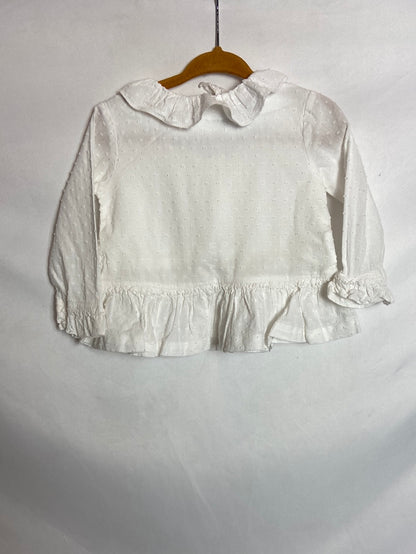 OTRAS. Blusa blanca plumeti volante. T 12 meses