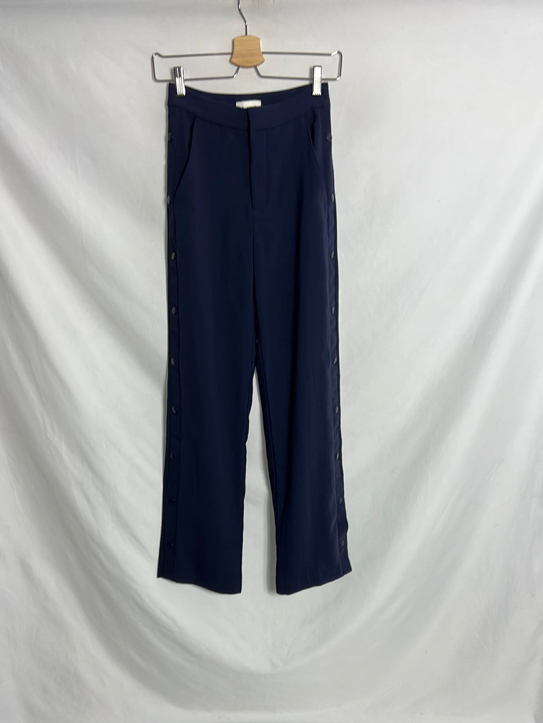 H&M. Pantalón azul palazzo abotonado. T 32