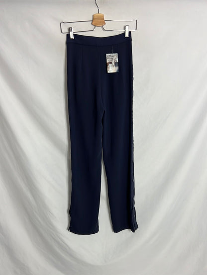 H&M. Pantalón azul palazzo abotonado. T 32