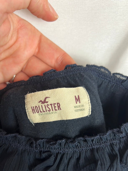 HOLLISTER. Top azul volantes. T M