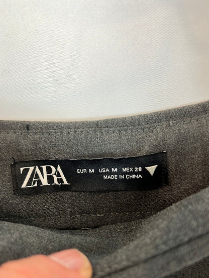 ZARA. Falda/pantalón gris tablas T.m