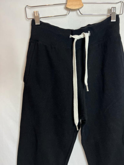 H&M. Pantalón negro felpa cordones blancos. T XS