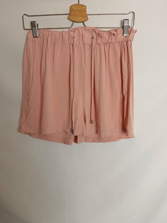 PRIMARK. Shorts rosa fluido T.38