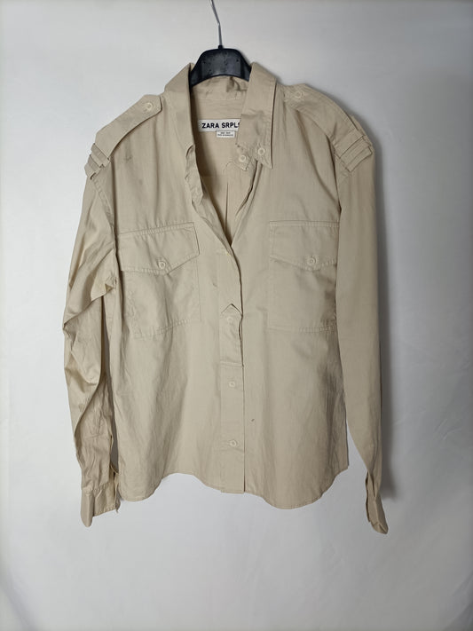 ZARA. Blusa beige bolsillos. T.M