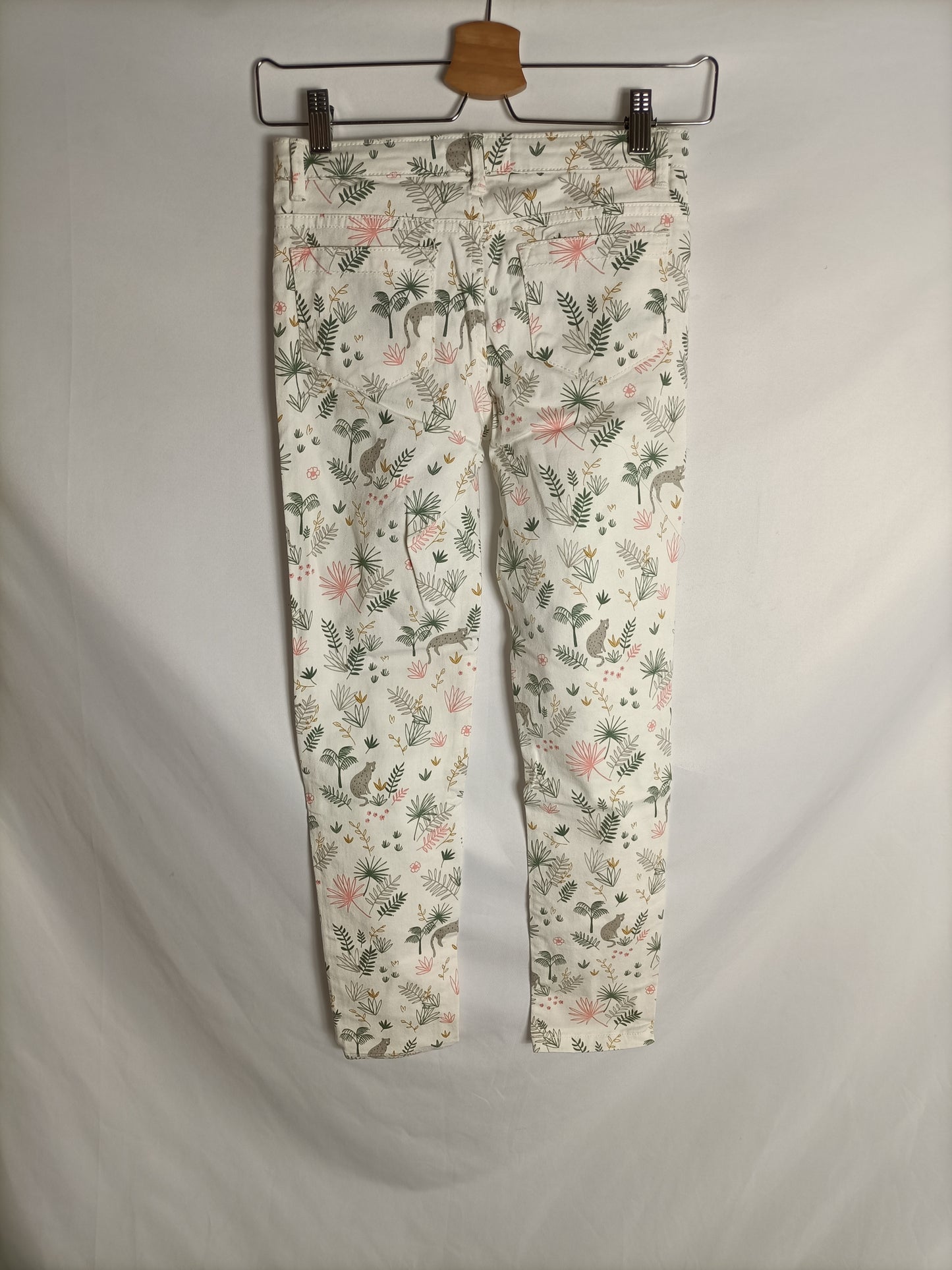 UNIT. Pantalón blanco roto estampado T.9-10 años