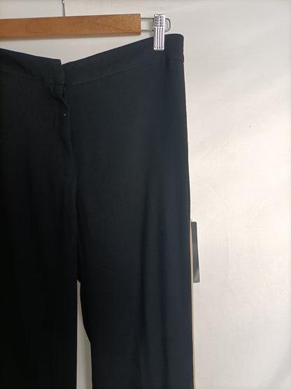 ZARA. Pantalón negros rayas T.xs