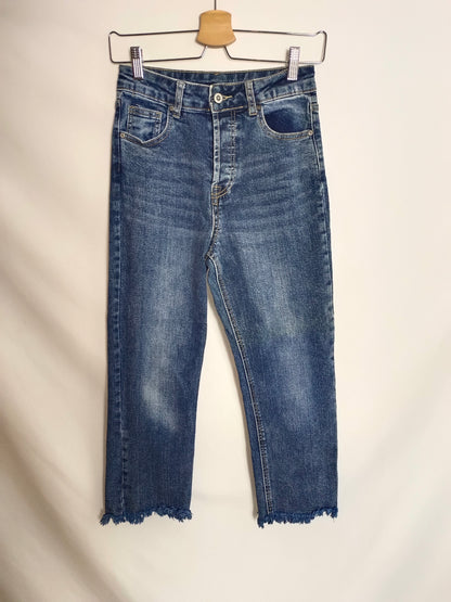 OTRAS. Pantalón denim flecos T.xs