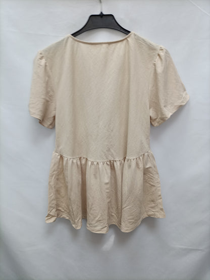 MANGO. Blusa abotonada beige T.xs