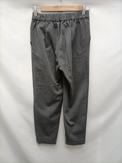 PULL&BEAR. Pantalón fluido gris T.s