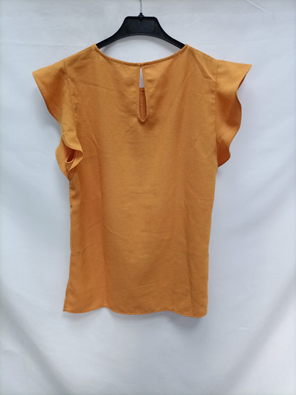 ZAR. Blusa mostaza volantes T.m