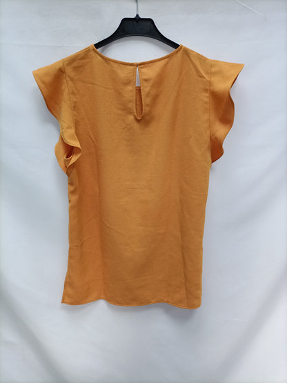 ZAR. Blusa mostaza volantes T.m