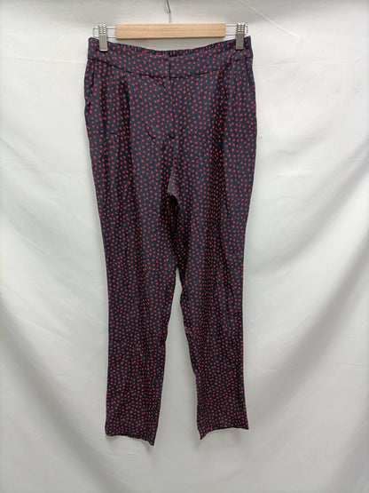 MANGO. Pantalón fluido topitos T.xs