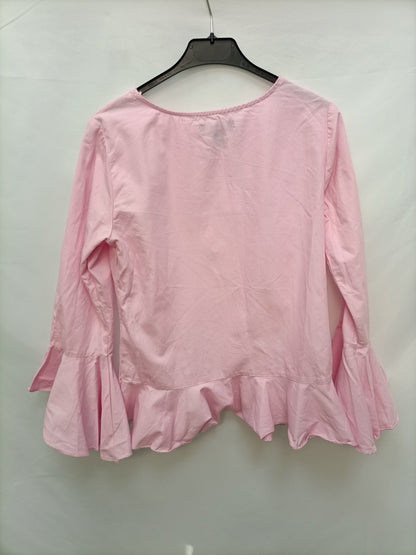 PRIMARK. Blusa rosa volantes T.36