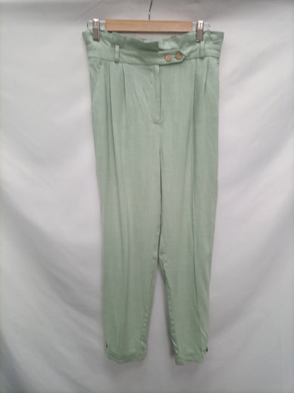 PRIMARK. Pantalón fluido verde T.38