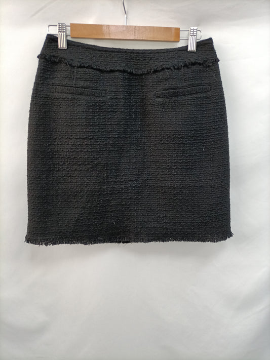 H&M. Falda tweed negra T.38