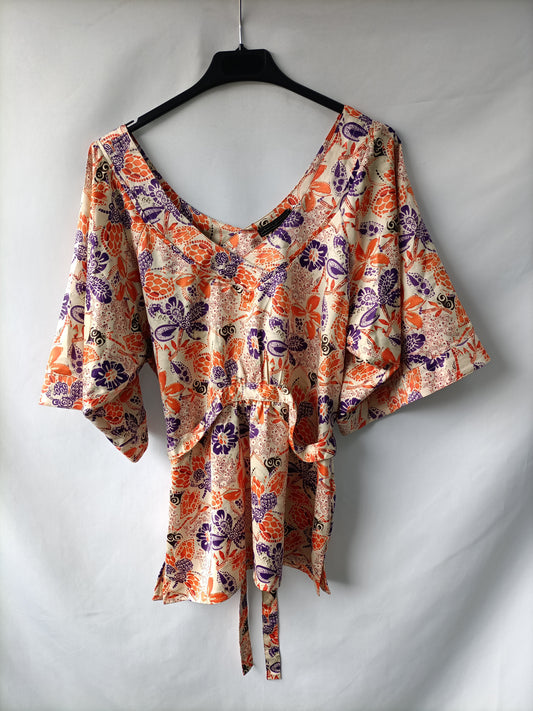 OTRAS. Blusa flores naranjas