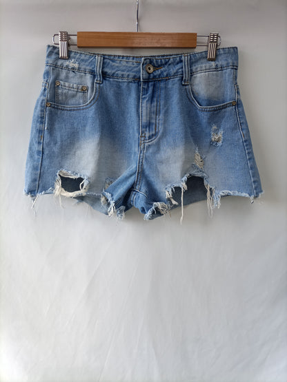 OTRAS. Shorts denim deshilachados T.m