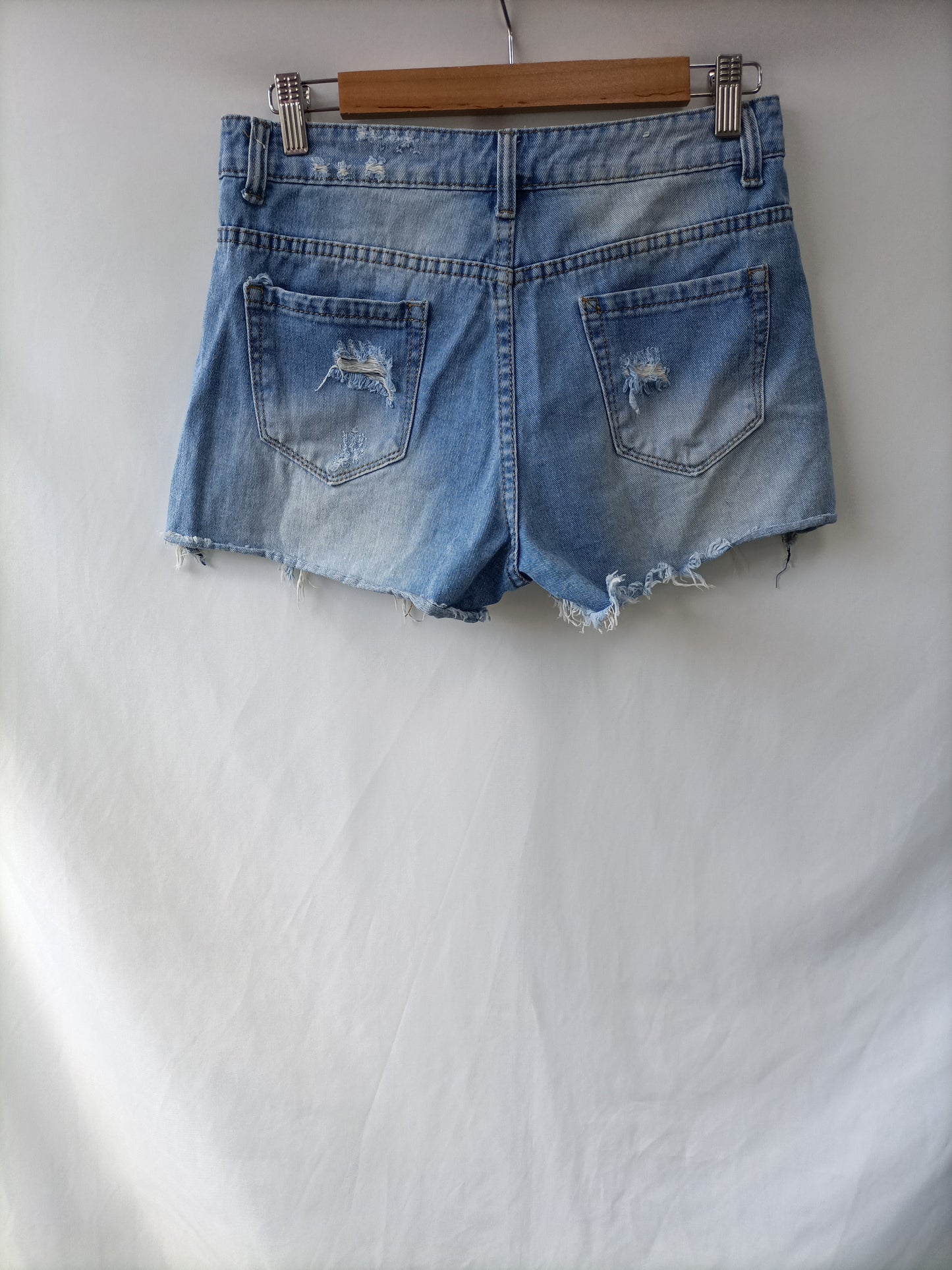 OTRAS. Shorts denim deshilachados T.m