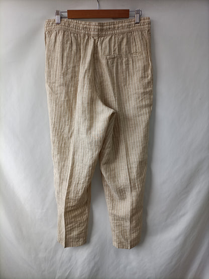 H&M. Pantalón beige rayas T.38