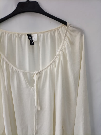 H&M. blusa blanca lazo T.38