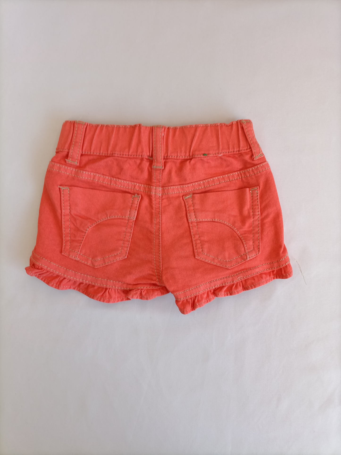 BENETTON. Shorts naranja T.1 año