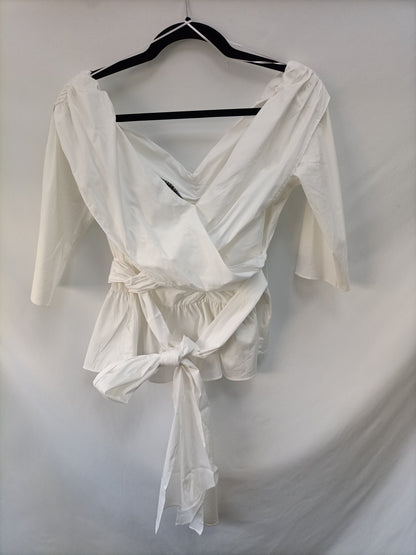 ZARA. Top blanco volante T.l