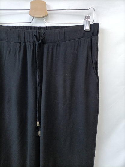 C&A. Pantalón Fluido negro T.s