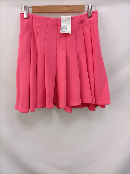 H&M. Falda rosa tablas T.36