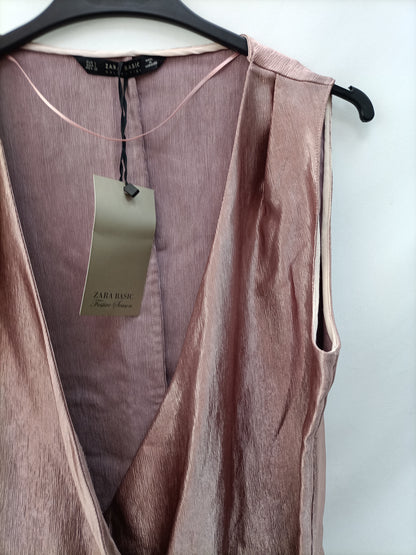 ZARA.Top rosa brillo T.S