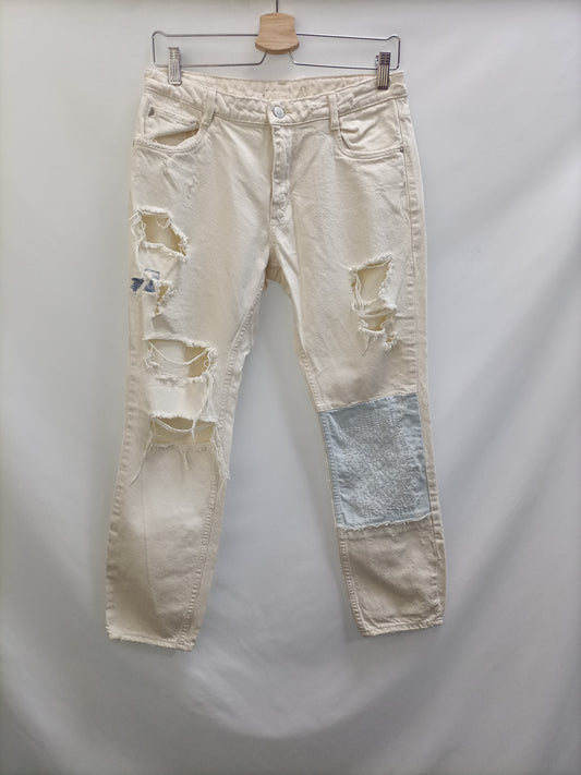 ZARA. Pantalón beige rotos T.34