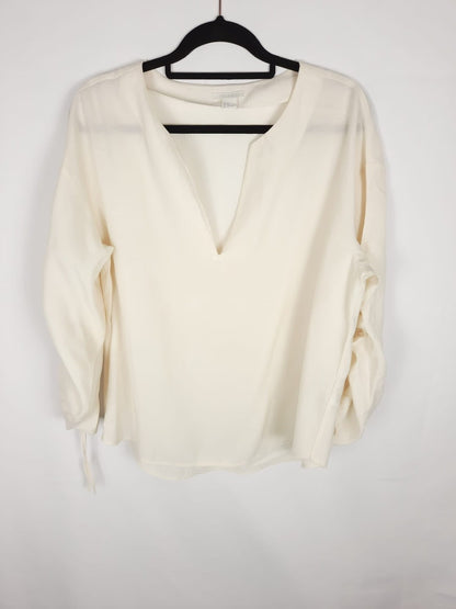 H&M. blusa pico T.46