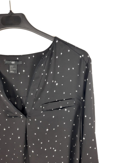 H&M. Blusa fluida negra estrellas T.34