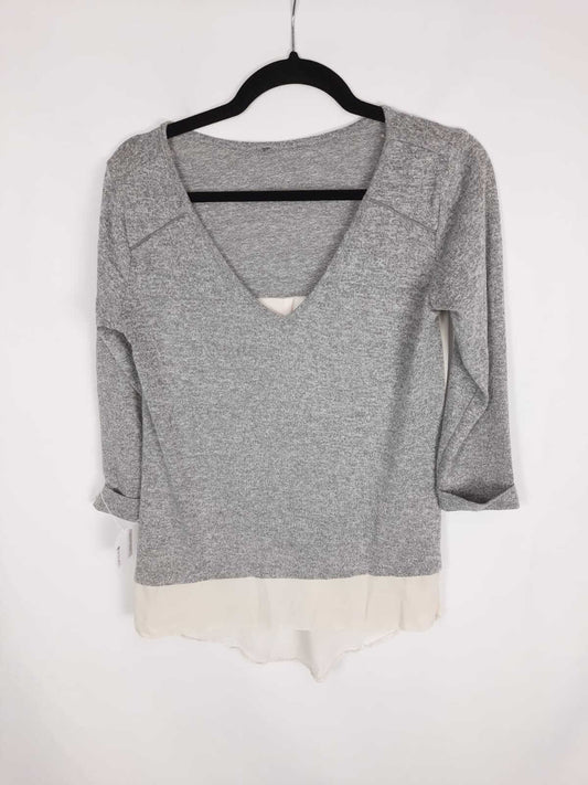 OTRAS.  Jersey gris jaspeada doble textura T.U