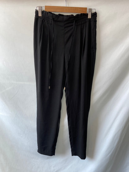 ZARA.Pantalones negros relajados T.XS