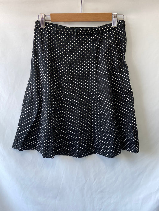 H&M. Falda negra lunares T.34