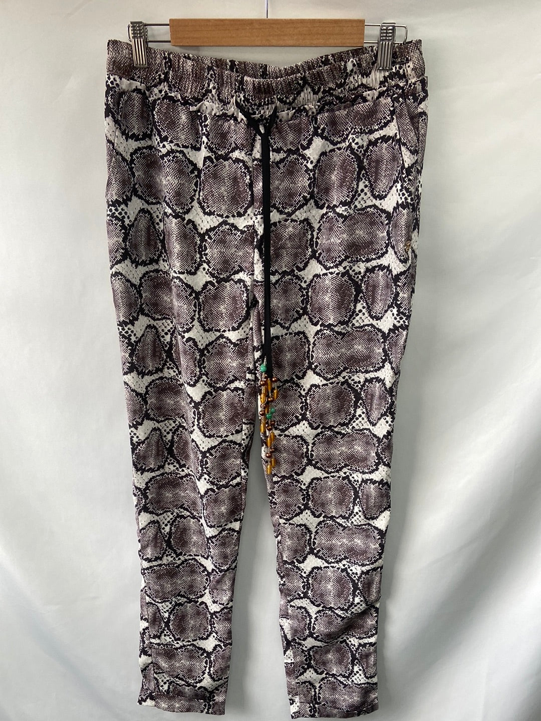 CUPLÉ.Pantalones fluidos animal print T.L