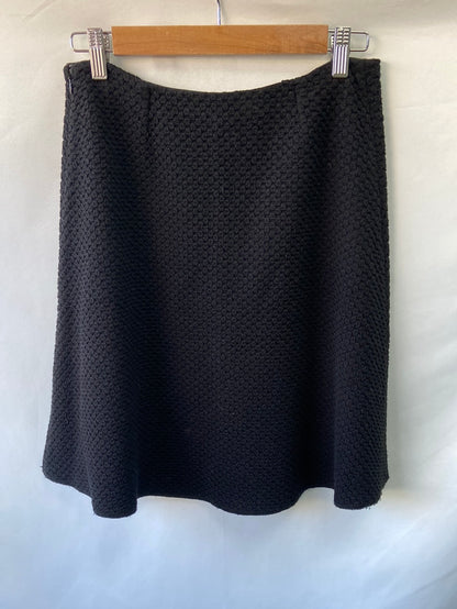 EMPORIO ARMANI. Falda corta negra textura T.44