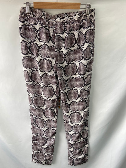 CUPLÉ.Pantalones fluidos animal print T.L